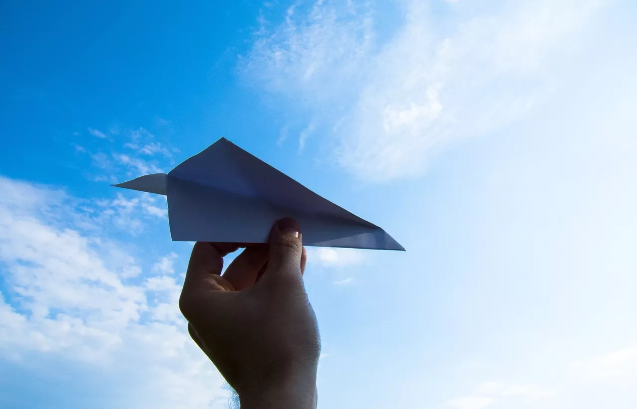 paper plane, hand, sky